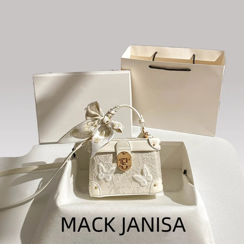 Elegant square handbag with floral butterfly lace design