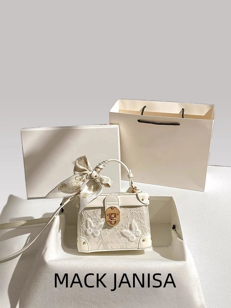 Elegant square handbag with floral butterfly lace design