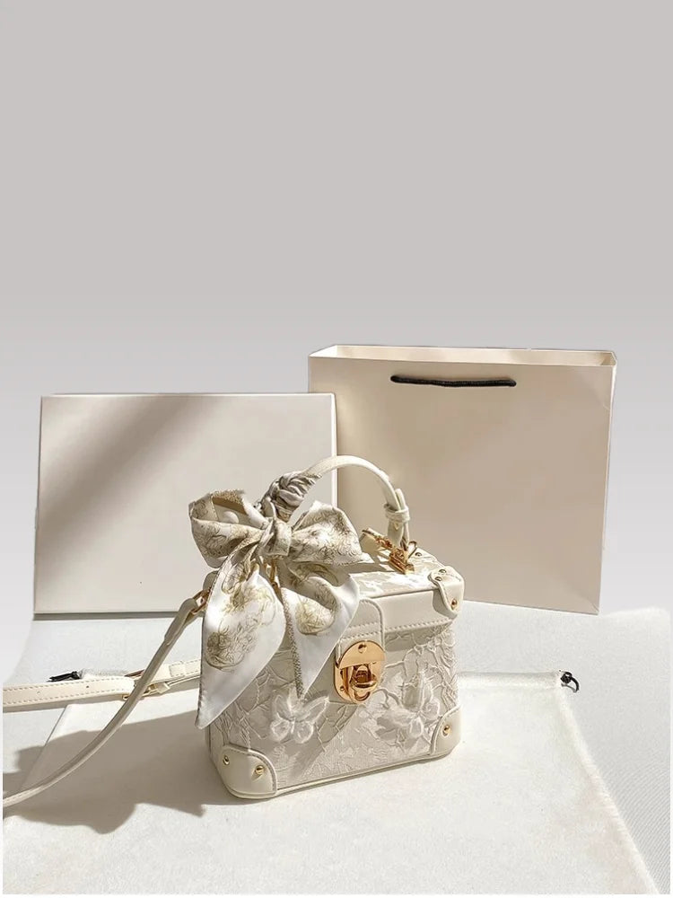 Elegant square handbag with floral butterfly lace design